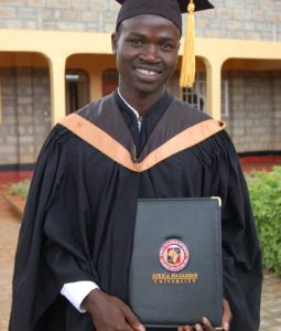 photo: young man with college diploma